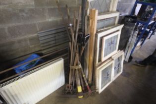 A quantity of long handled garden tools to include