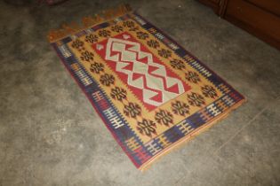 An approx. 5'11" x 3'4" Kelim rug