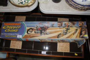 A Matchbox chopper chase game sold as a collectors