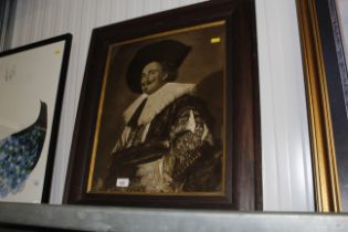 An oak framed print of a laughing cavalier