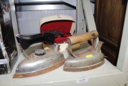 A Globetrotter travel iron and two other irons