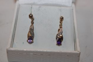 A pair of Hallmarked 9ct gold amethyst and diamond