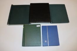 A box containing five stamp albums