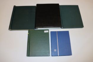 A box containing five stamp albums