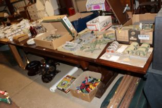 A large oak draw leaf dining table raised on stret