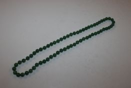 A string of jade coloured beads