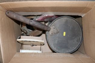 A large copper saucepan and lid with iron handles;