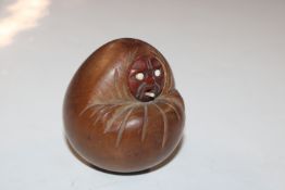 A Japanese carved nut Okimono