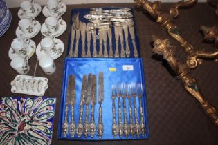 A quantity of plated fish knives and forks; and si