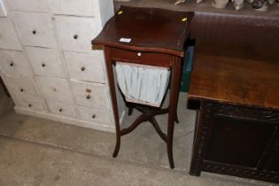 An Edwardian worktable with silks bag below