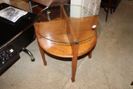 An Art Deco design circular coffee table with plat