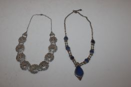 A white metal and lapis lazuli necklace and a fili
