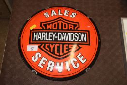 A reproduction Harley Davidson circular enamel adv