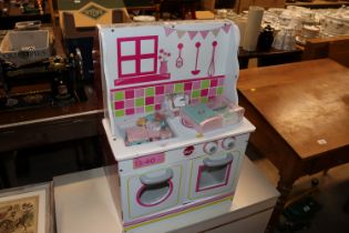 A Plum child's dolls house kitchen