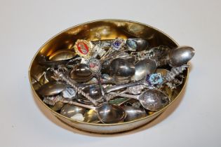 A tin of souvenir spoons