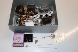 A box of various costume jewellery