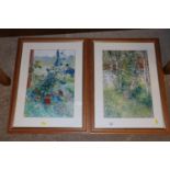 Two framed coloured prints of flowers and a woodla