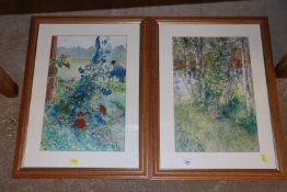 Two framed coloured prints of flowers and a woodla