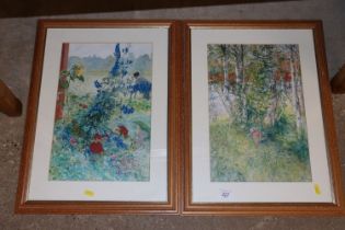 Two framed coloured prints of flowers and a woodla