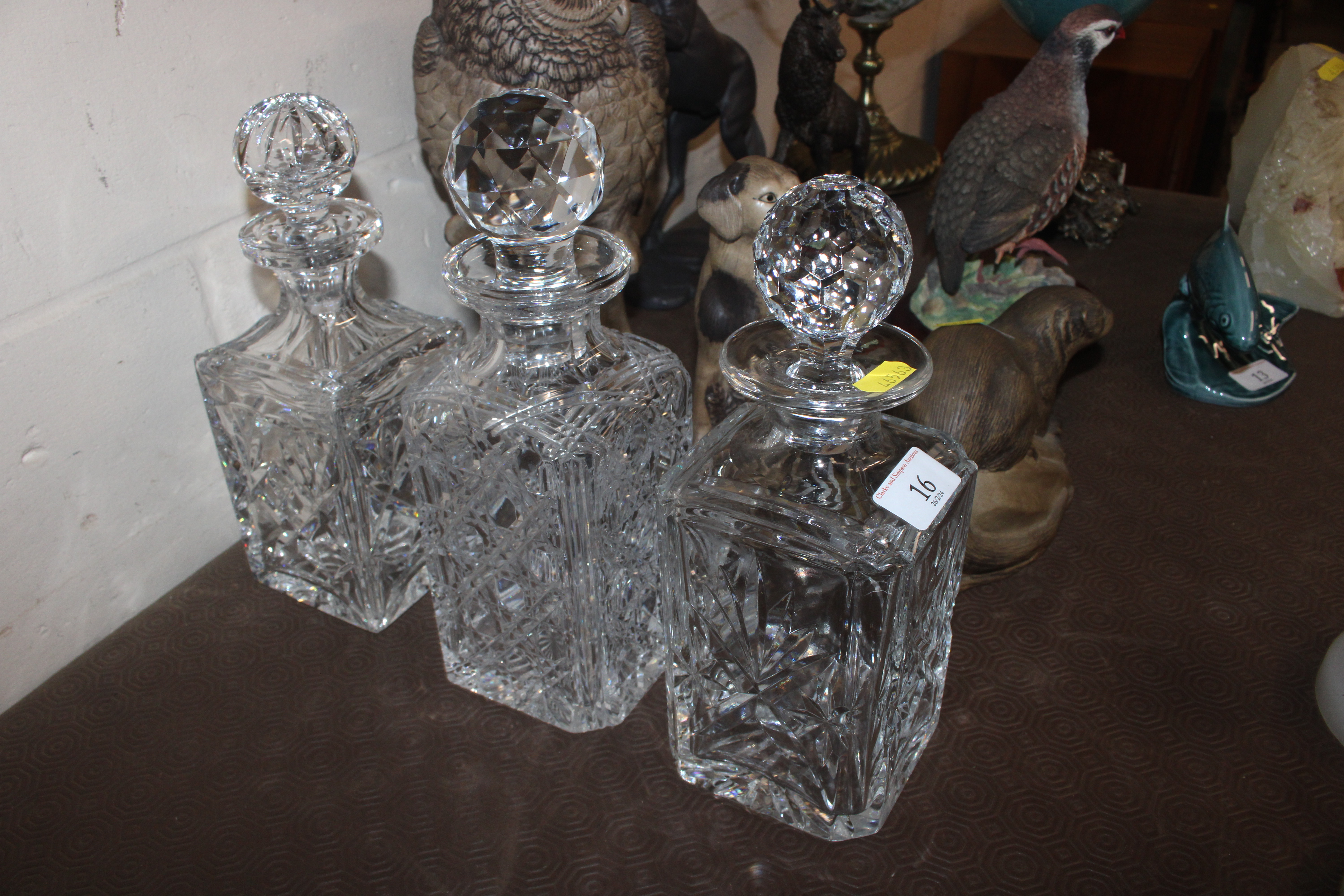 Three square cut glass decanters