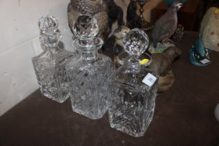 Three square cut glass decanters