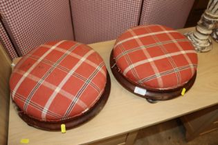 A pair of mahogany and chequered upholstered foots