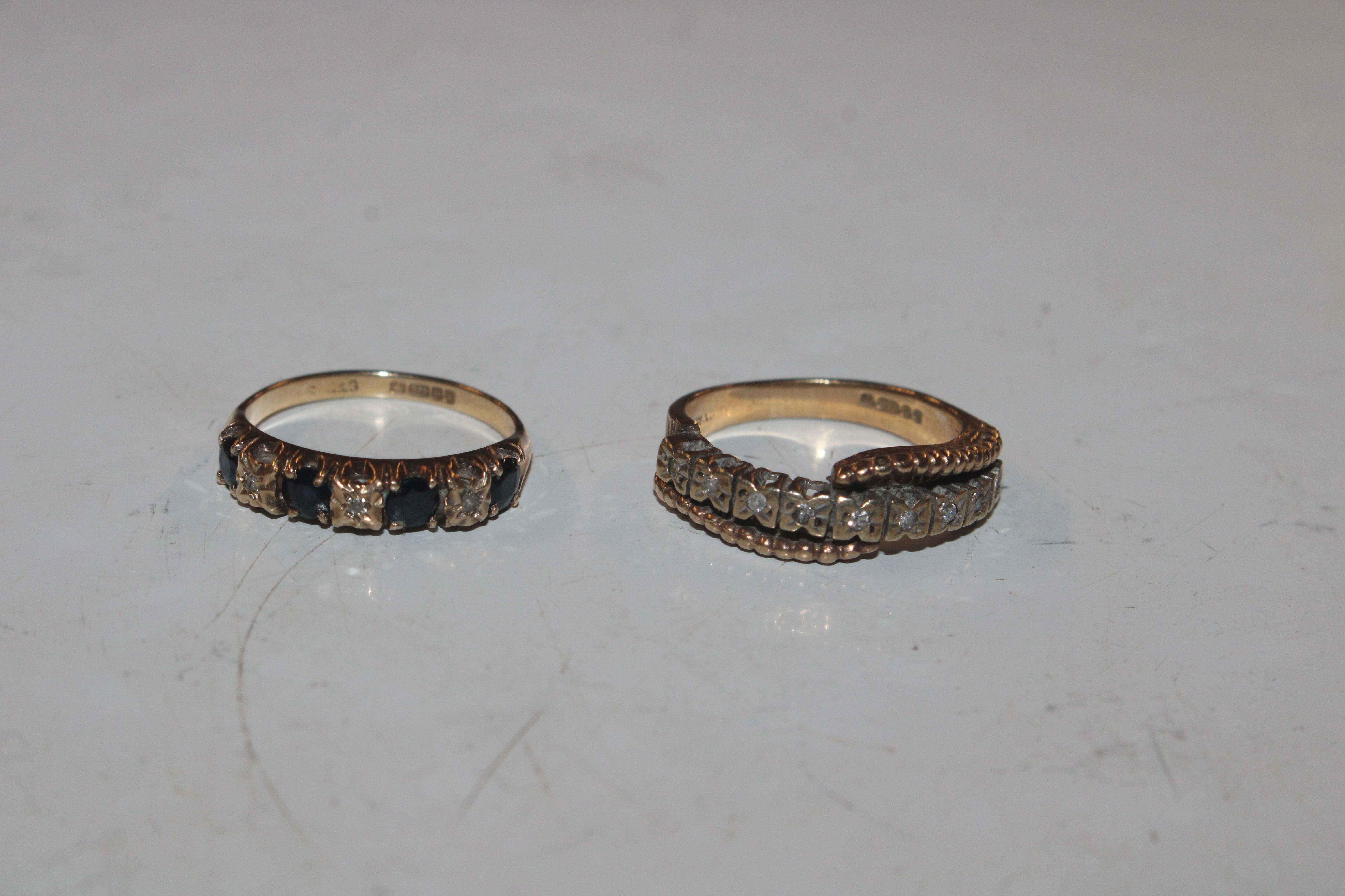 A 9ct gold half eternity ring set with chip diamon