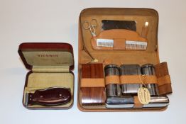 A men's cased grooming kit and a Viceroy hair clip
