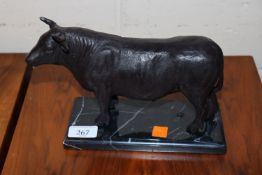 A bronzed figure of a bull