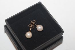 A pair of 9ct gold and cultured pearl stud ear-rin