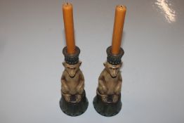 A pair of reproduction candlesticks in the form of