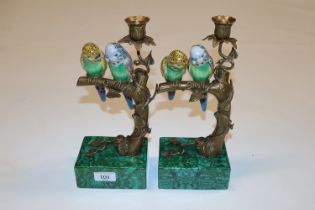 Two bronze and porcelain candlesticks decorated wi