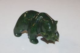 A carved jade coloured ornament in the form of a b