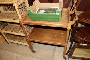 A mid-20th Century light oak two tier tea trolley