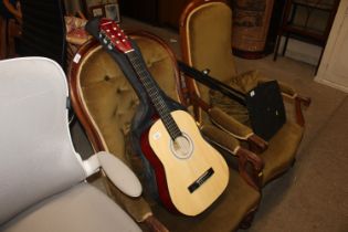 A Rocket Music acoustic guitar and carry bag