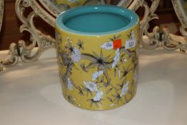 A Chinese porcelain yellow glazed brush pot