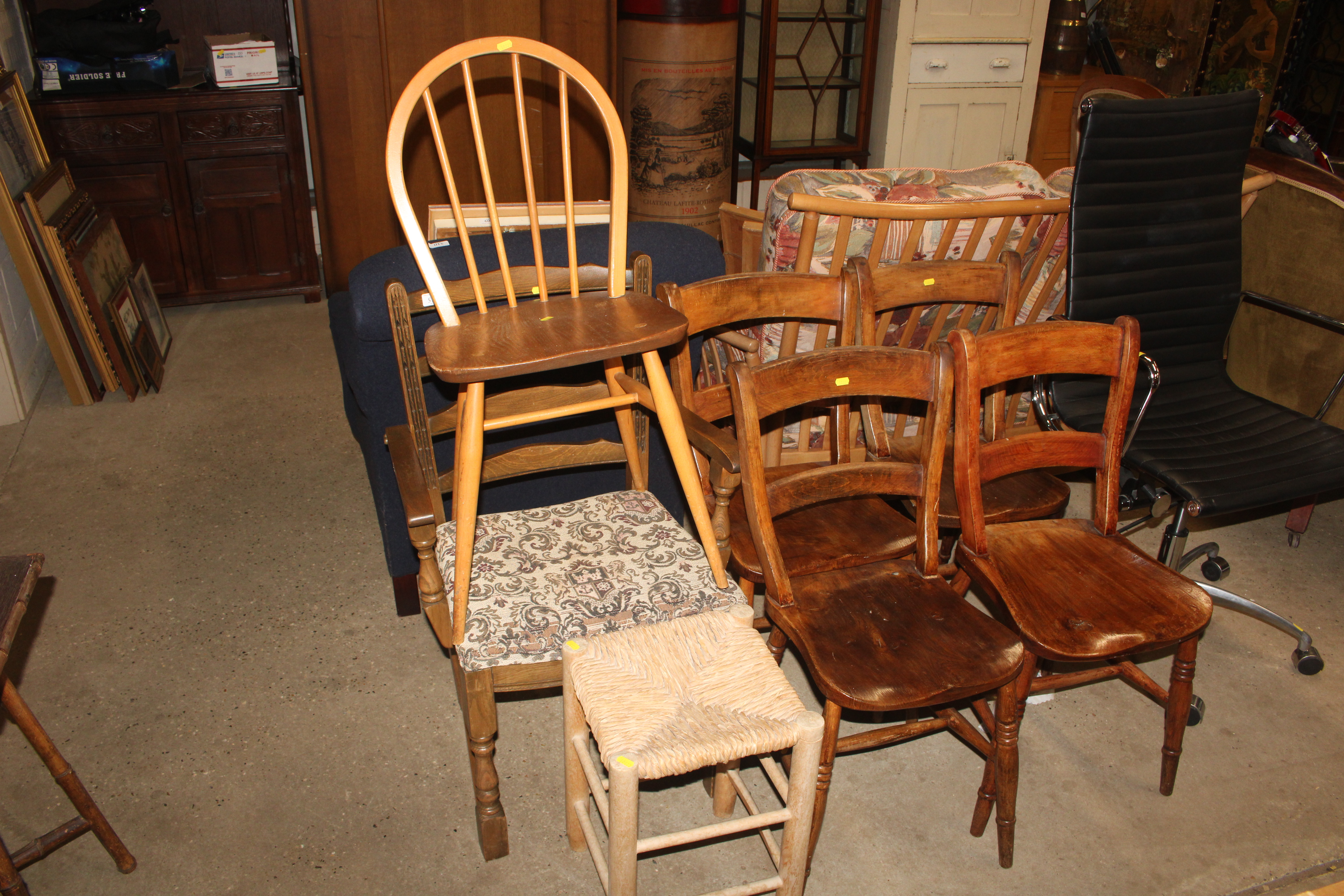 Four bar back elm seated chairs; an Ercol stick ba