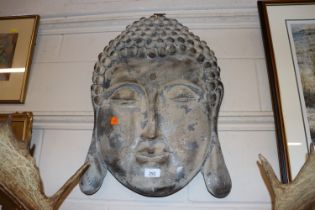 A Buddha head wall plaque