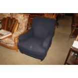 A blue upholstered armchair