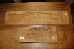 Two wooden moulds