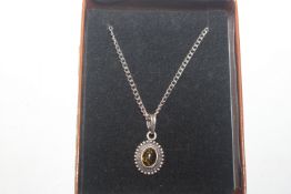 A 925 silver and amber pendant on chain