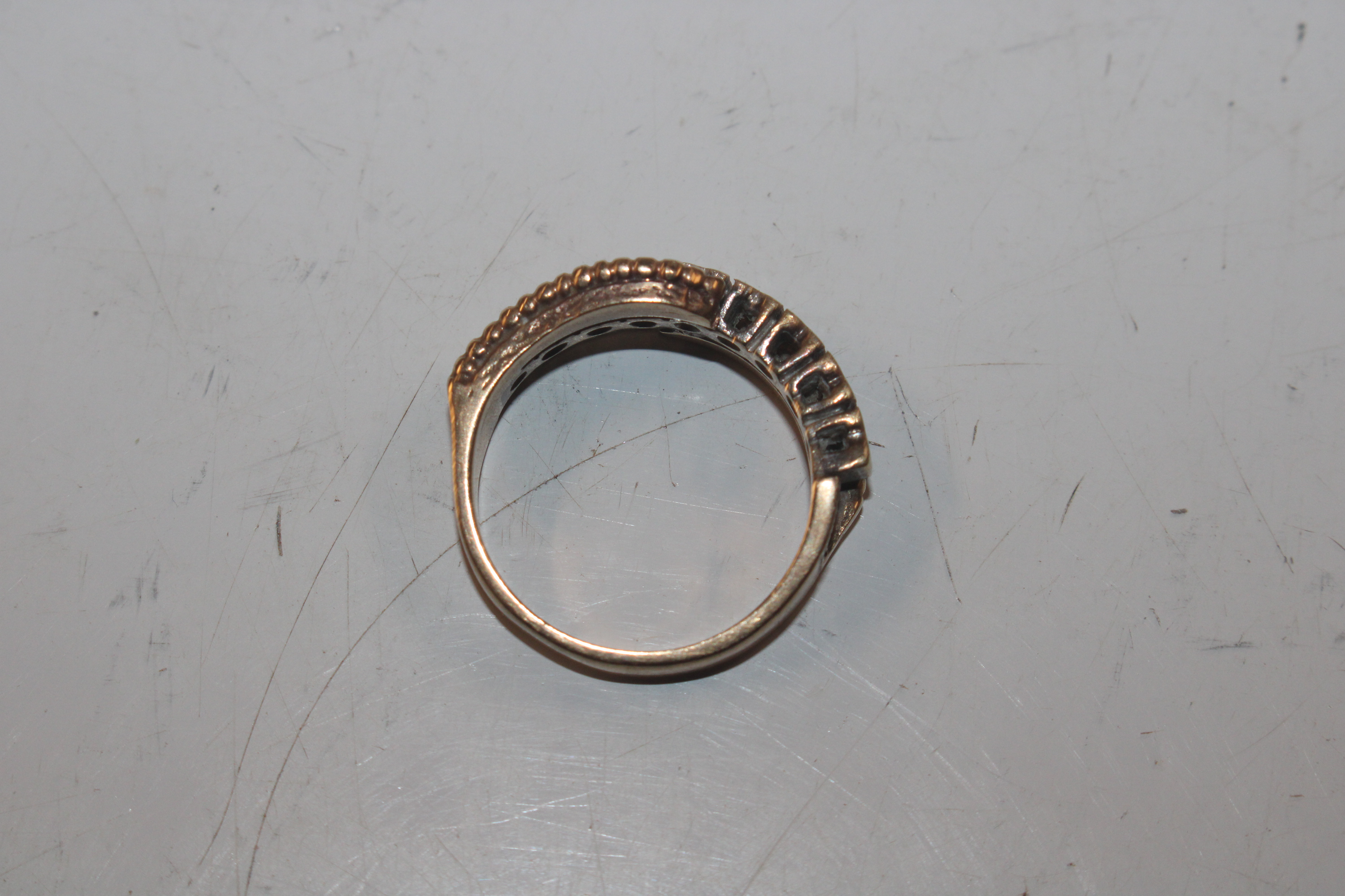 A 9ct gold half eternity ring set with chip diamon - Image 8 of 10