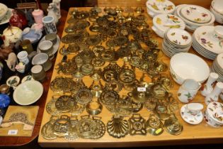 A quantity of various antique horse brasses