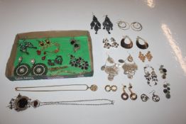 A box of various ear-rings