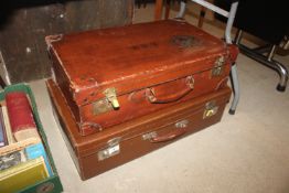 Two leather vintage suitcases, one with old luggag