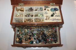 A wooden jewellery chest and contents to include n