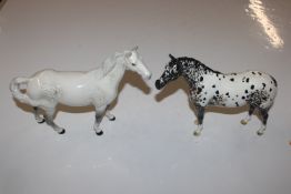 A Beswick model of a grey horse and a Beswick mode