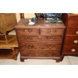 A Georgian mahogany chest of two short and three l