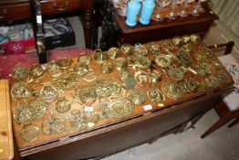 A collection of various horse brasses