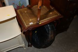 A vintage leather pouffé and a nest of tables